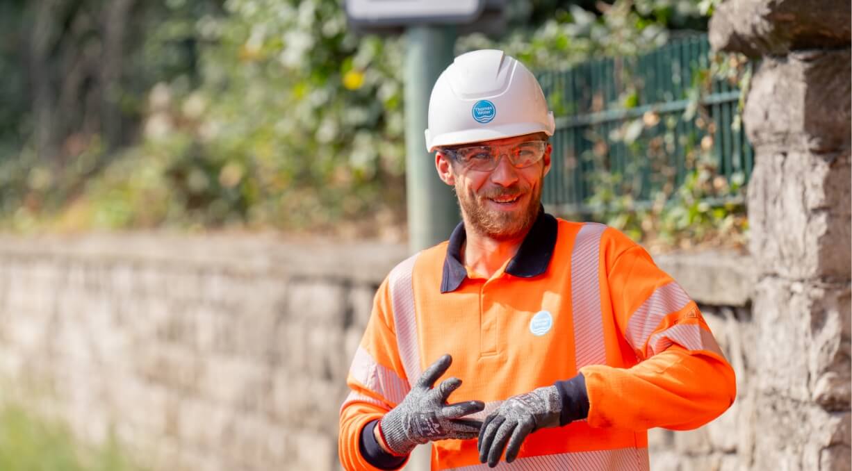 Person with hardhat smiling