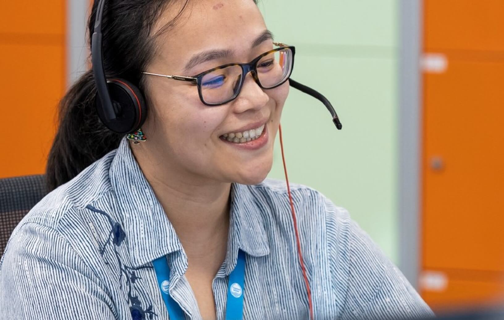 Person smiling talking on headset