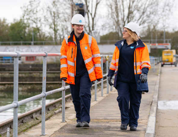 Two Thames Water apprentices walking and talking on an operational site