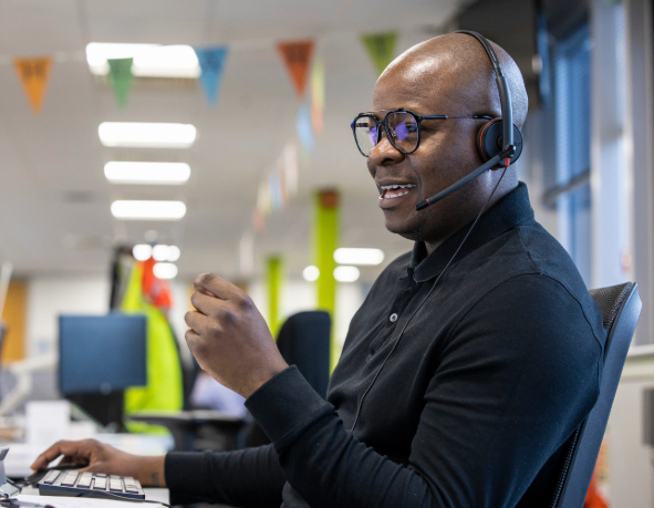 a customer agent speaks to a customer on the phone