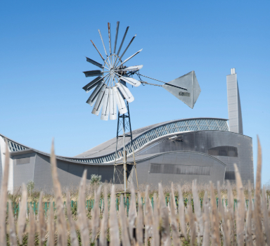 a wind pump with a view of the wave centre at crossness