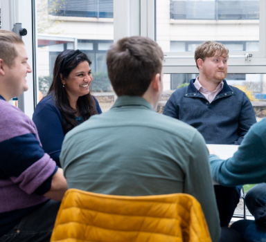 a team of colleagues at lunch in the cafe