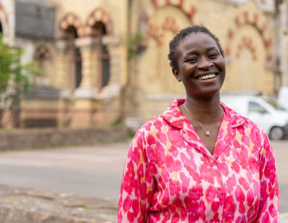 a colleague smiles in conversation