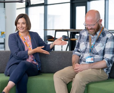 Two Thames Water colleagues laughing in conversation