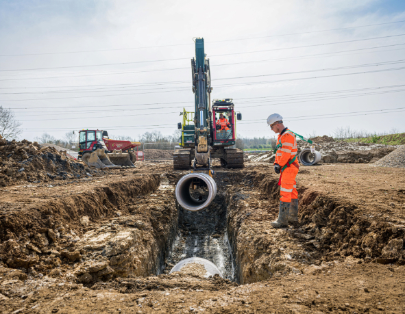Major project works with a Thames Water colleague in PPE involved in a pipe installation