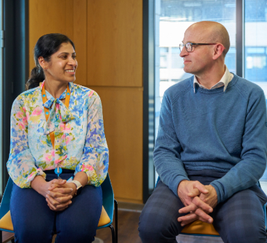 Two Thames Water colleagues smile in conversation