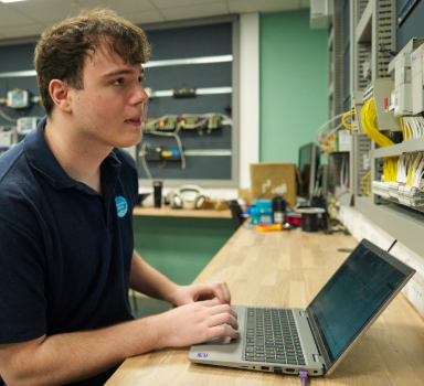A Thames Water colleague using a laptop