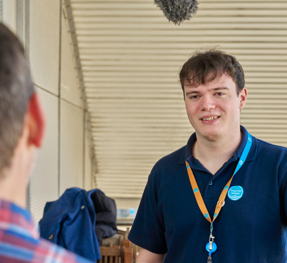 A Thames Water colleague smiles while being interviewed