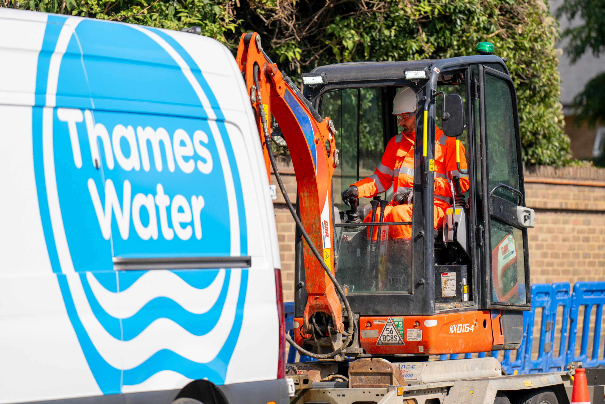 Engineer working next to Thames Water van